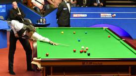 Ronnie O’Sullivan progresses in ‘stinky old shoes’
