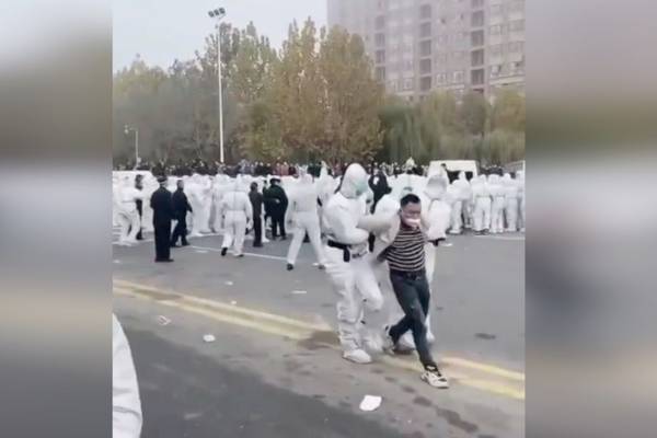Workers and police clash following protest at world's largest iPhone factory in China