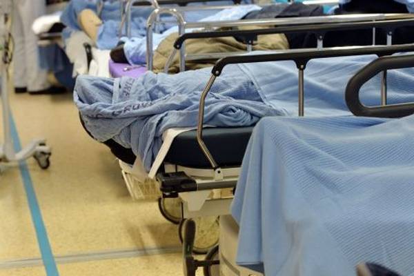 Flu kills 44 as hundreds wait on trolleys in hospitals