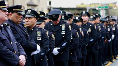 New York mayor appeals for reconciliation at slain officer’s funeral