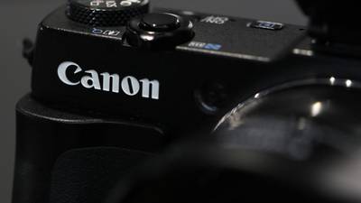 Office equipment sales lift Canon profit target for 2014