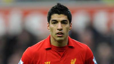 Suarez welcomes Arsenal interest and hints he may stay in England