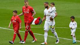Swansea dismiss young Liverpool side to secure survival