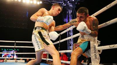 Michael Conlan defies a hand injury to secure victory in Belfast