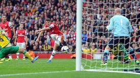 Özil grabs two as Arsenal hold on to top spot