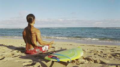 Strike a pose, catch a wave on a yoga and surfing break