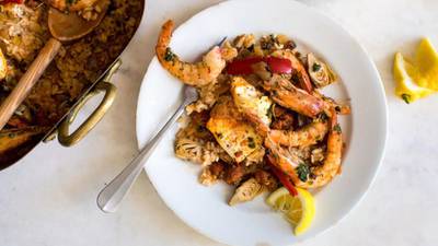 Yotam Ottolenghi’s baked ‘paella’ with prawns, chorizo and salsa verde