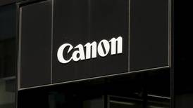 Canon cuts outlook as weak camera sales hit profits