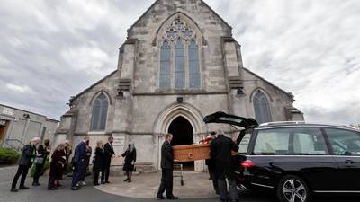 Hundreds watch online as mourners bid farewell to songwriter Shay Healy