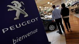 Peugeot pledges return to profit, tight cash control