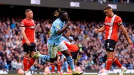 Manchester City climb back to summit with convincing win over Luton 