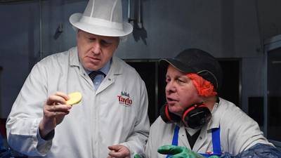 Cheese and union: Johnson defends Brexit deal in NI Tayto factory