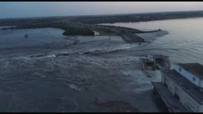 Drone footage shows water gushing out from destroyed Ukraine dam