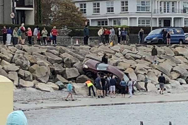 Two adults taken from car after it slides off Salthill promenade in Galway