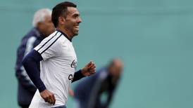 Carlos Tevez heads home to Boca Juniors