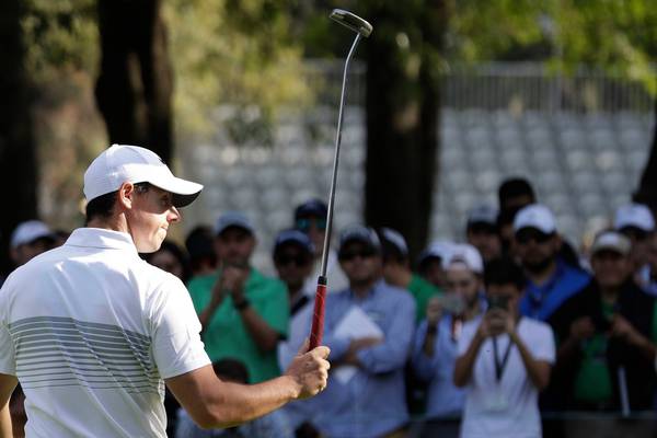 Rory McIlroy makes light of illness and layoff to move into lead