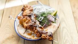 Barbecued chicken shawarma with flatbread and tzatziki