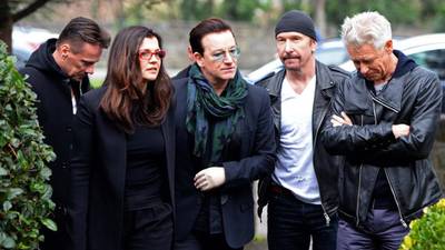U2 play tribute at funeral  of radio DJ Tony Fenton