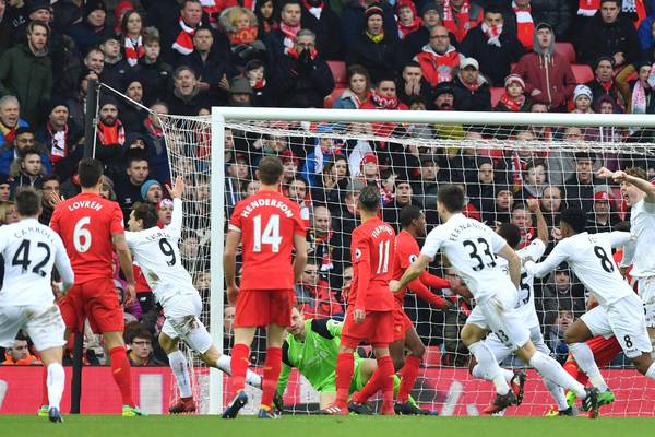 Liverpool title challenge dented by Swansea sensation