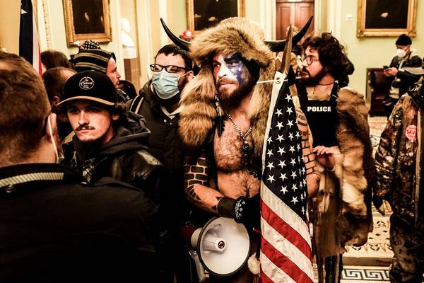 US Capitol rioter ‘QAnon Shaman’ sentenced to over three years in prison