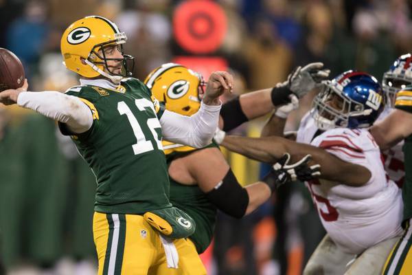 NFL play-offs: Aaron Rodgers’ Hail Mary helps Packers past Giants