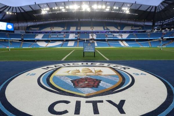 Man City fan remains in a coma in Belgium as five suspects appear in court
