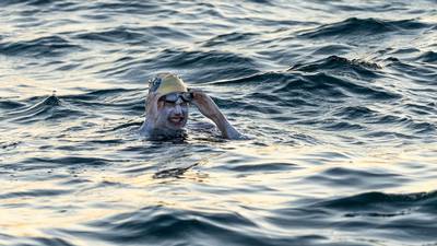 Cancer survivor is first to swim across English Channel four times non-stop
