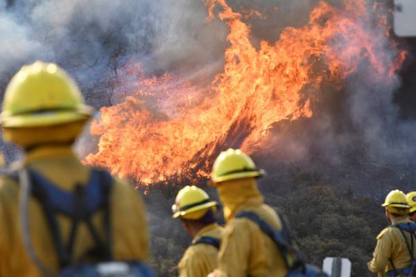 Firefighters hope to gain control over California wildfire as winds persist