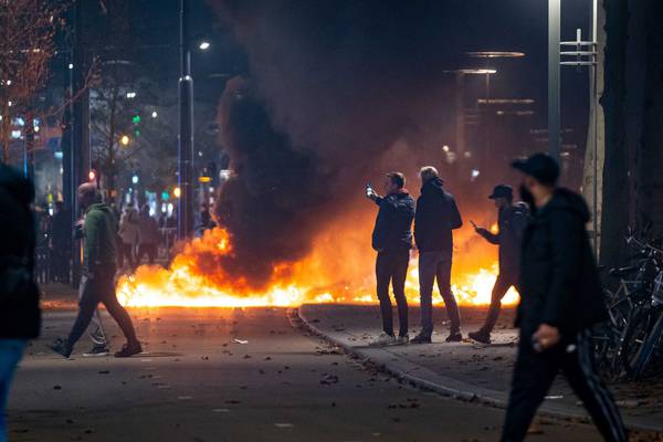 Who were the rioters who smashed through Rotterdam and The Hague?