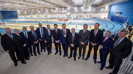 How many men in suits does it take to open a new sports arena?