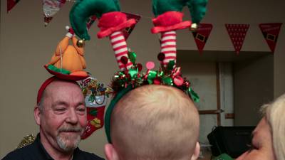 Santa arrives with presents and reassurances at party for homeless children