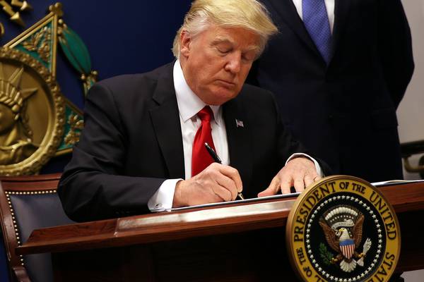Trump defends travel ban amid growing criticism