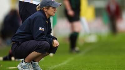 Why is it so unusual for a woman to manage a camogie team?