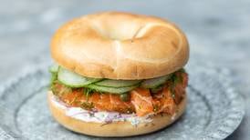 NYC style cured salmon and cream cheese bagel with pickled cucumber