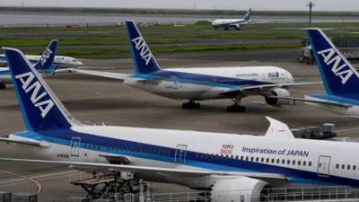 Tokyo flight makes U-turn after passenger boarded in error