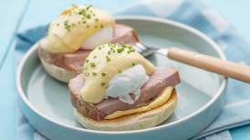 Classic eggs Benedict with thick glazed ham and hollandaise