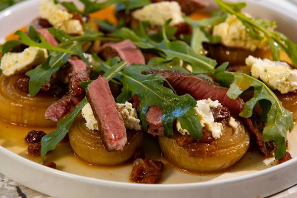 Slow-roasted onions with steak, Boursin and rocket