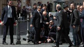 Gunman shoots two policemen in Rome as new government sworn in