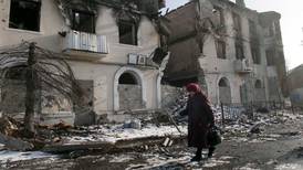 Ukraine truce shaken by battle for flashpoint town