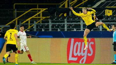 Haaland double sees Dortmund through despite Sevilla fightback