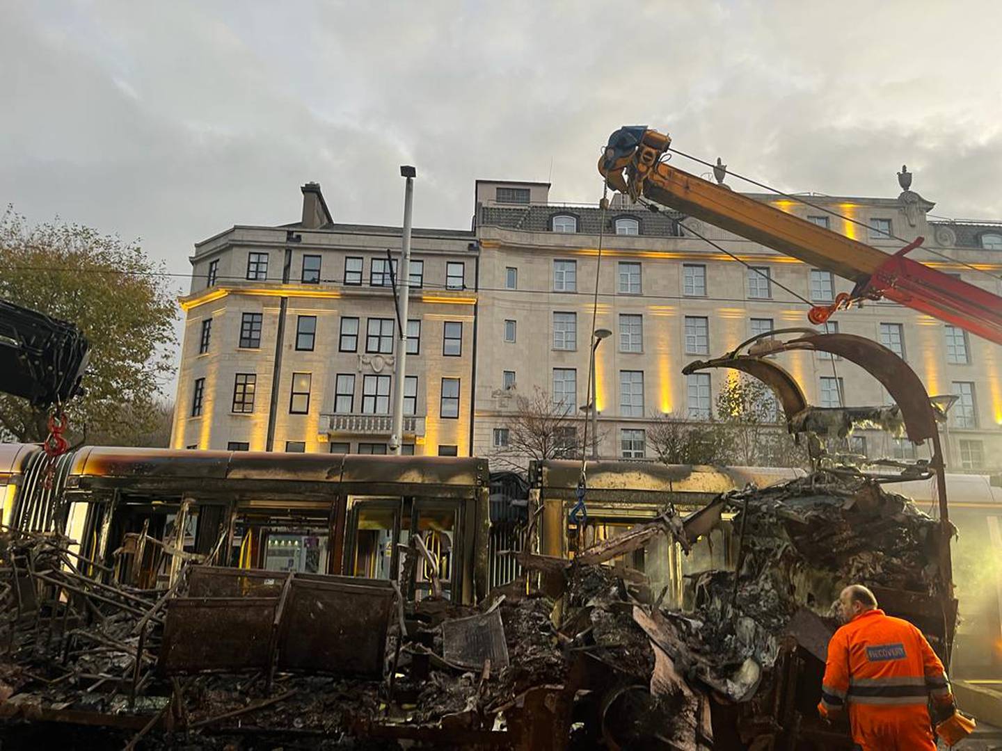 Burned out vehicles and a Luas in Dublin city centre on Friday morning after rioting in the capital on Thursday night. Photograph: Conor Pope