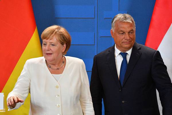 Merkel and Orban call for unity at border where Iron Curtain cracked
