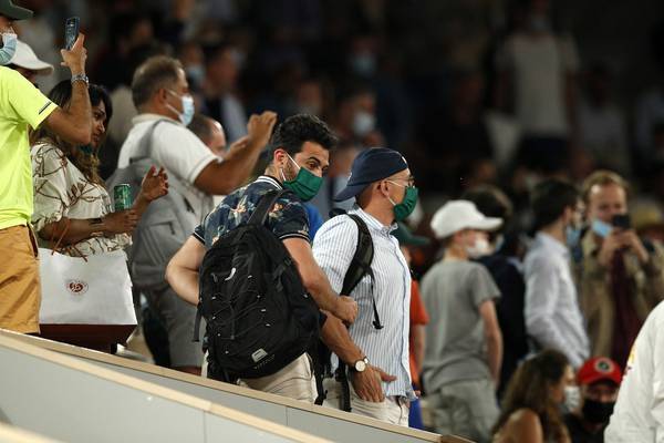 Djokovic sets up Nadal semi-final as fans sent home