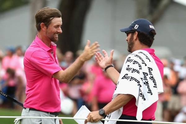 Webb Simpson holds on to take Players Championship
