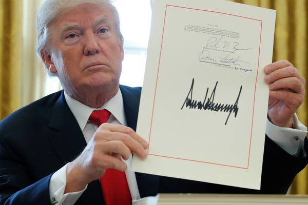 Trump signs package of tax cuts into law ahead of time