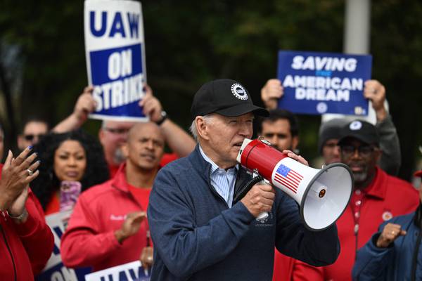 Biden becomes first modern president on picket line as he backs Michigan car workers