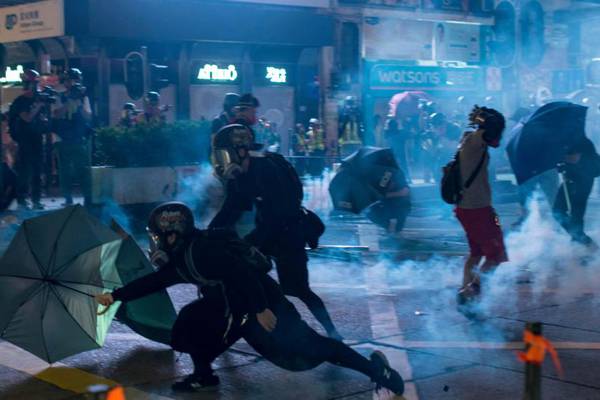 Hong Kong riot police fire tear gas at pro-democracy demonstrators