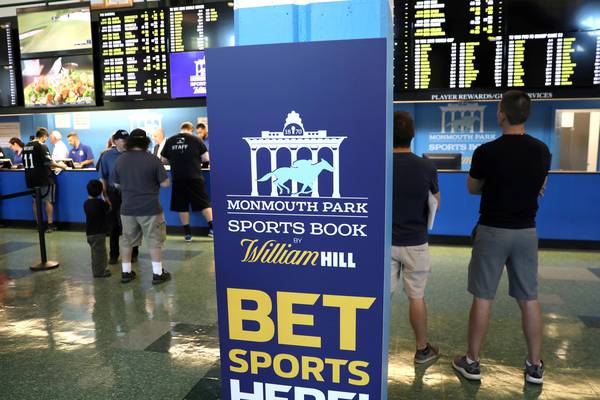 William Hill profit hit by regulatory cap and US expansion costs