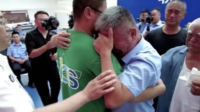 After 24-year search, parents reunited with kidnapped son in China