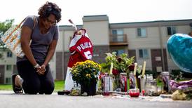 Calm returns to Ferguson but questions remain over shooting
